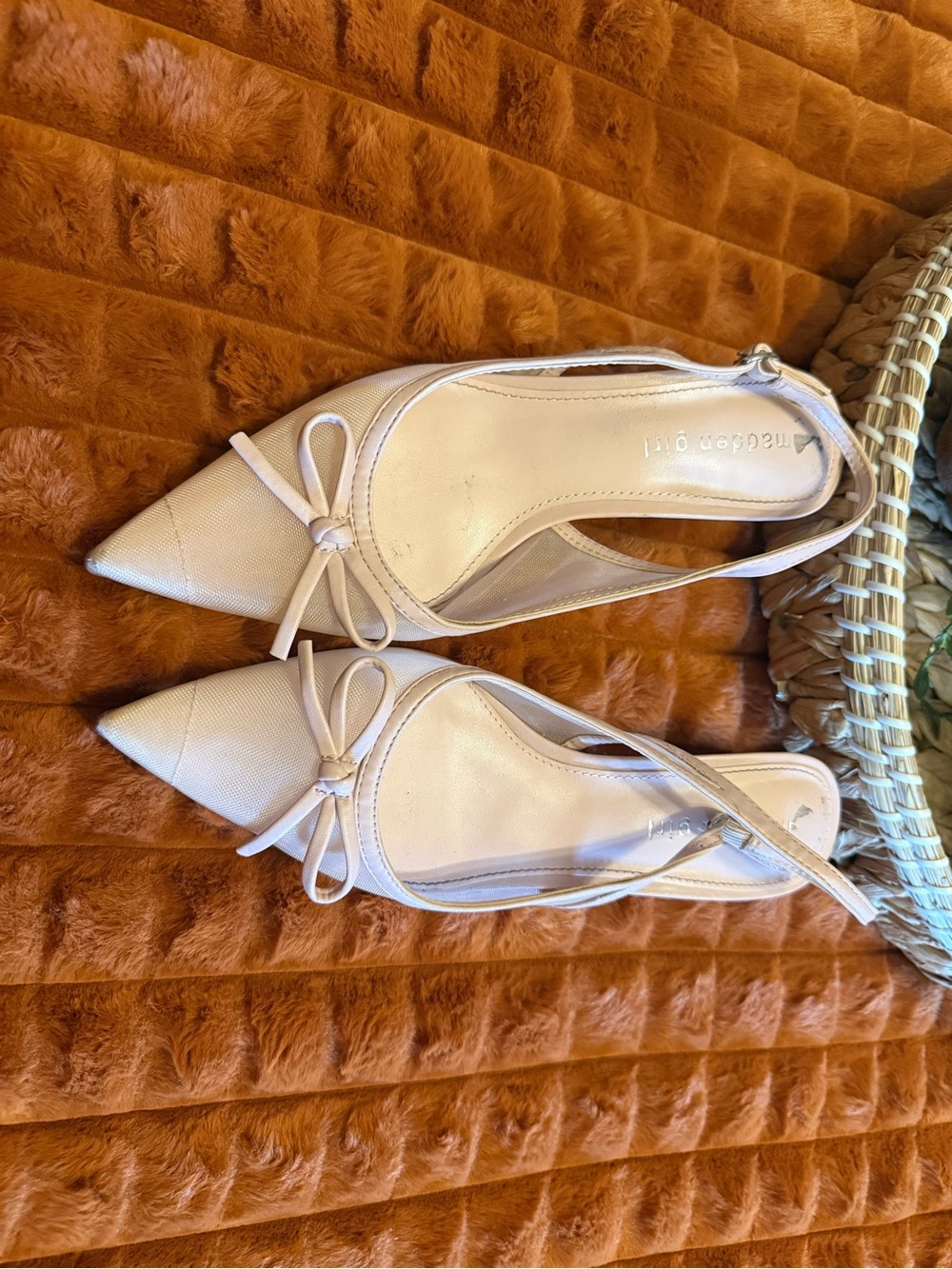 Madden Girl pointed-toe slingback kitten heels with bow detailing.